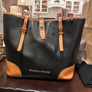 Dooney and Bourke black leather shopping tote purse with brown trim pink inside